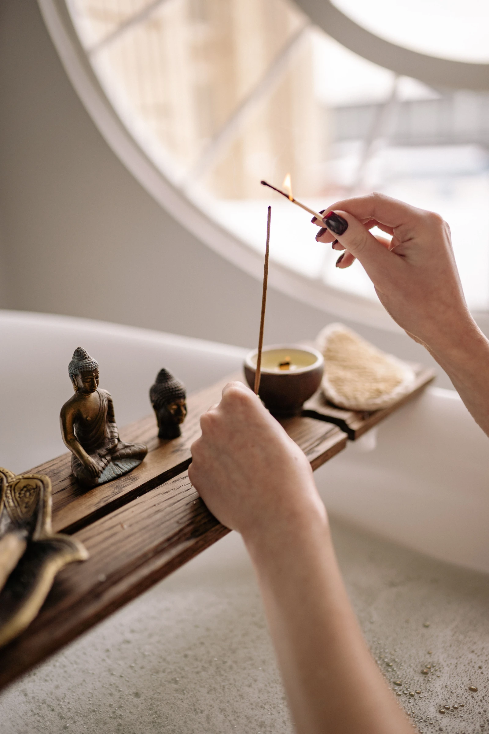 Wellness practitioner treating a client in a calm studio