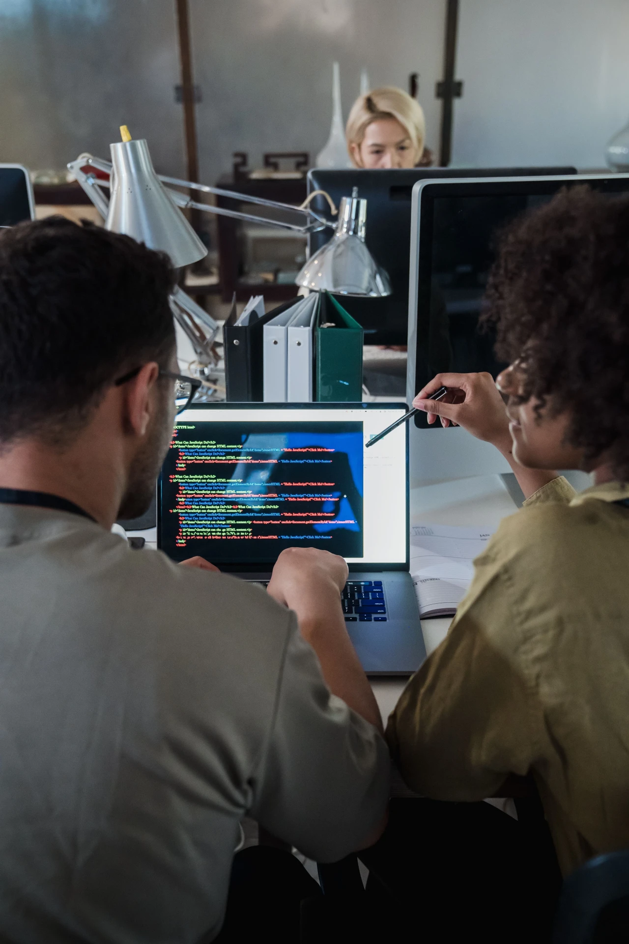 Tech professional working at a computer